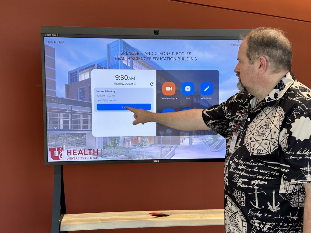 Photo of person using the "Start Meeting" button